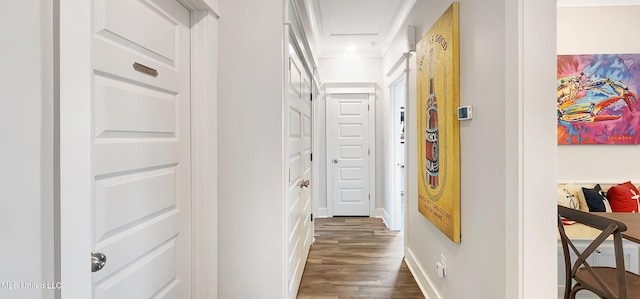 hall featuring dark wood-style floors and baseboards