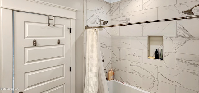 bathroom with shower / bathtub combination with curtain