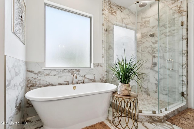 111 Jefferson Davis Pkwy, Picayune, MS 39466 - bathroom with a marble finish shower, a freestanding tub, and tile walls