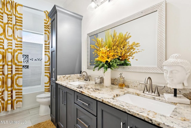 111 Jefferson Davis Pkwy, Picayune, MS 39466 - full bath featuring double vanity, toilet,  shower combination, and wood finished floors