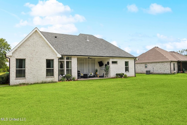 111 Jefferson Davis Pkwy, Picayune, MS 39466 - rear view of property with a ceiling fan, a patio, a lawn, central AC unit, and brick siding