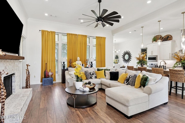 111 Jefferson Davis Pkwy, Picayune, MS 39466 - living area featuring ceiling fan, a fireplace, recessed lighting, crown molding, and dark wood-type flooring