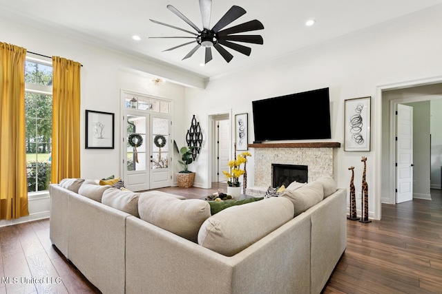 111 Jefferson Davis Pkwy, Picayune, MS 39466 - living area featuring ceiling fan, dark wood-style flooring, baseboards, crown molding, and a glass covered fireplace