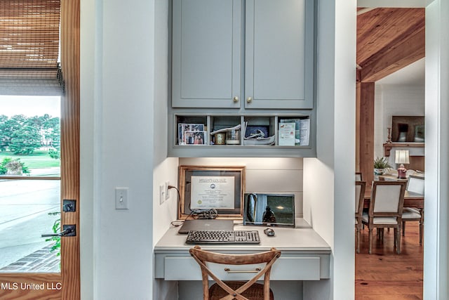 office area featuring built in desk and wood-type flooring