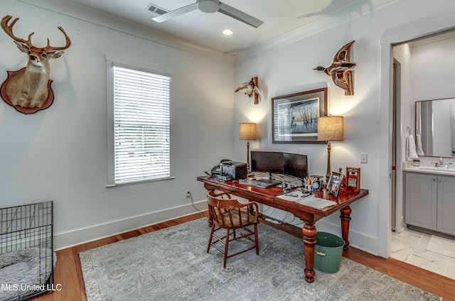 office area with ornamental molding, hardwood / wood-style flooring, sink, and ceiling fan