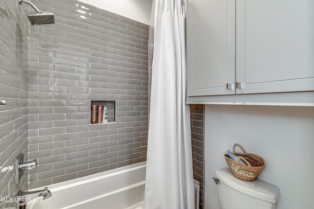 bathroom featuring toilet and shower / bath combo