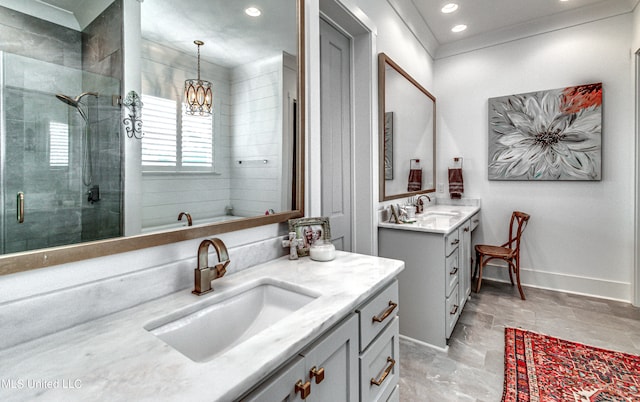 bathroom with vanity, a notable chandelier, and walk in shower