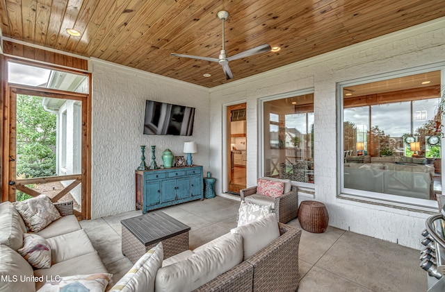 interior space featuring ceiling fan and wooden ceiling