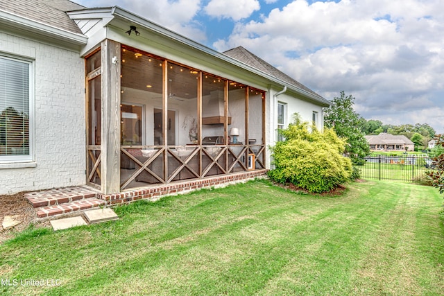 view of yard with a sunroom