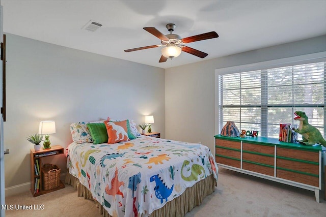 bedroom featuring carpet floors, baseboards, visible vents, and a ceiling fan