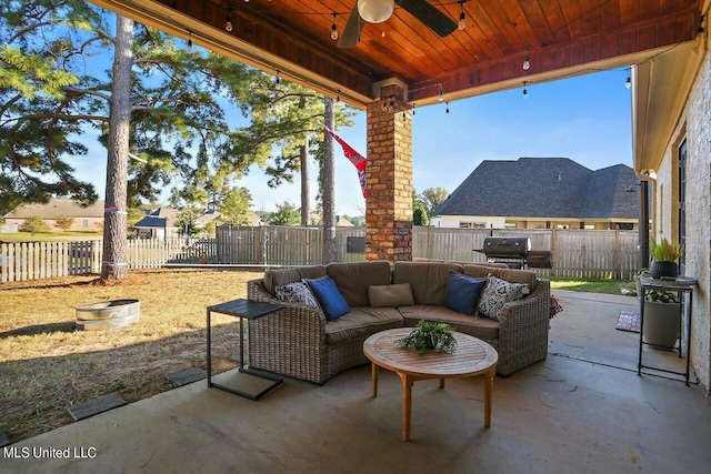 view of patio featuring ceiling fan, a fenced backyard, and an outdoor living space