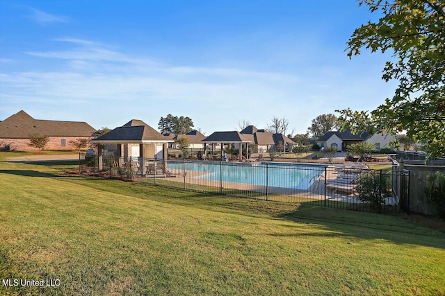 view of swimming pool featuring a patio and a lawn