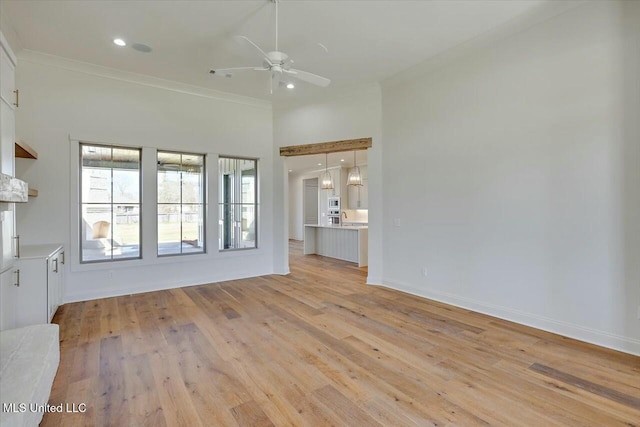 unfurnished living room featuring baseboards, recessed lighting, a ceiling fan, and light wood-style floors