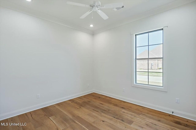 empty room with recessed lighting, ceiling fan, light wood-style flooring, and baseboards