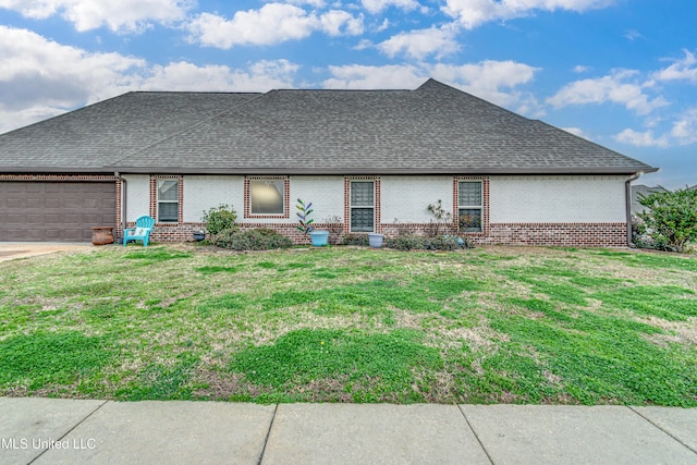 ranch-style house with a garage and a front yard