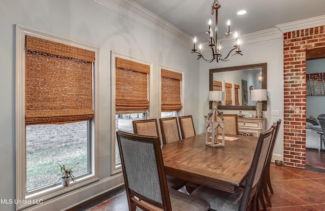 tiled dining area with crown molding and a notable chandelier