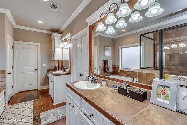 bathroom with crown molding, tile patterned floors, vanity, and separate shower and tub