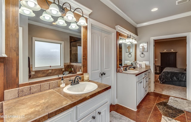 bathroom featuring crown molding, vanity, and tile patterned flooring