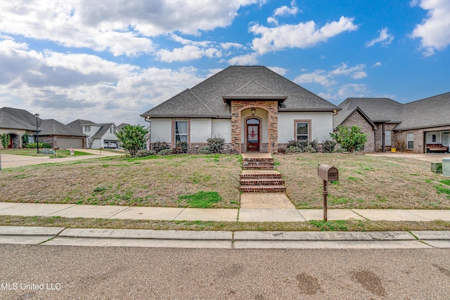 french provincial home with a front lawn