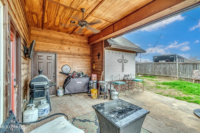 view of patio featuring ceiling fan