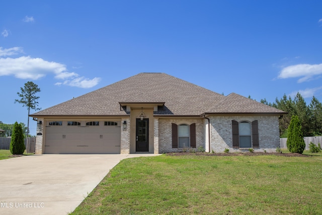 163 Frye Cir, Caledonia, MS 39740 - french provincial home with concrete driveway, a garage, roof with shingles, and brick siding