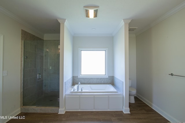 163 Frye Cir, Caledonia, MS 39740 - bathroom featuring toilet, a bath, a shower stall, wood finished floors, and ornamental molding