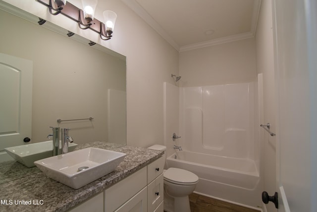 163 Frye Cir, Caledonia, MS 39740 - full bath featuring vanity, ornamental molding, toilet,  shower combination, and wood finished floors