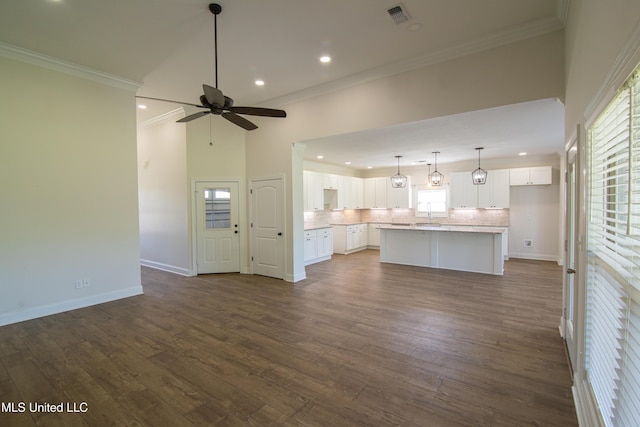 163 Frye Cir, Caledonia, MS 39740 - unfurnished living room with recessed lighting, a ceiling fan, crown molding, dark wood-type flooring, and baseboards