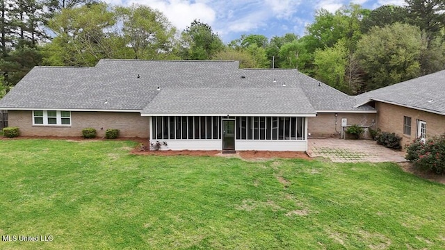 5285 Williamson Rd, Clinton, MS 39056 - rear view of house featuring a sunroom, a shingled roof, and a lawn