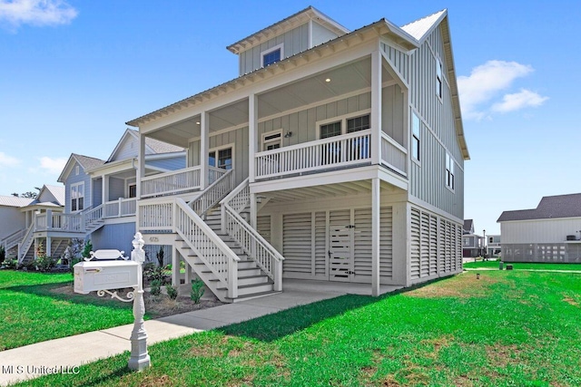 coastal inspired home with covered porch and a front yard