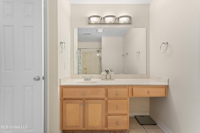 bathroom with tile patterned floors, vanity, and a shower with shower curtain