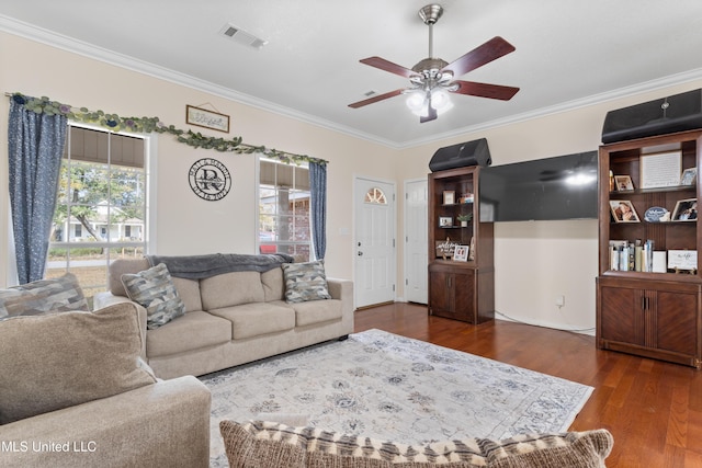 living room with ceiling fan, dark hardwood / wood-style floors, and ornamental molding