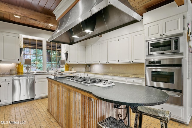 kitchen featuring tasteful backsplash, wood ceiling, stainless steel appliances, white cabinets, and beam ceiling