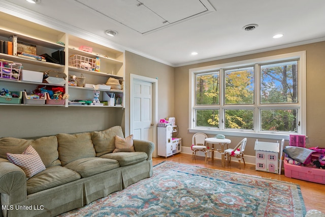 interior space featuring light hardwood / wood-style floors and crown molding