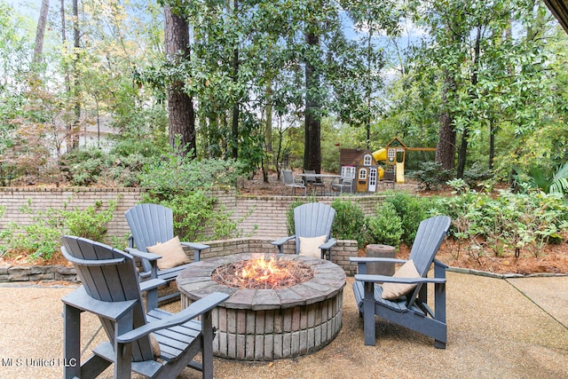 view of patio with an outdoor fire pit