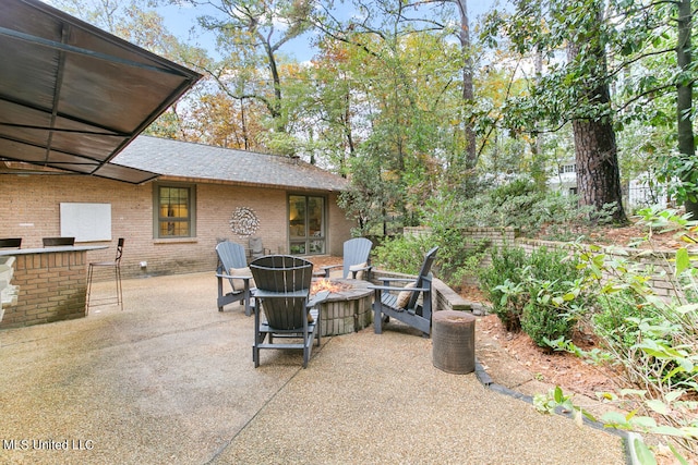 view of patio with a fire pit