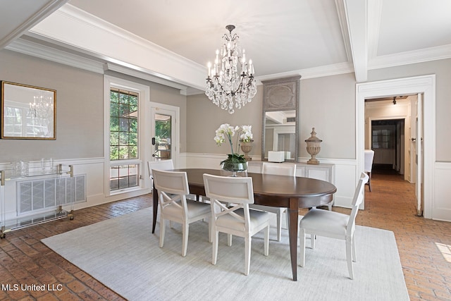 dining area with an inviting chandelier, crown molding, and beamed ceiling