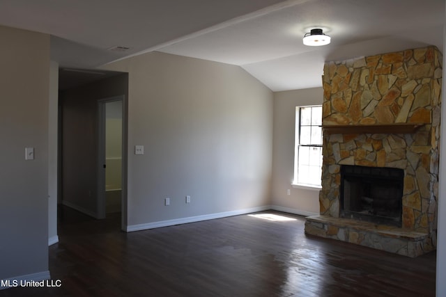 unfurnished living room featuring a fireplace, baseboards, dark wood-type flooring, and lofted ceiling