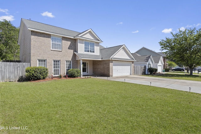 11222 Cypress Bayou Dr, Gulfport, MS 39503 - view of front facade featuring fence, a front lawn, driveway, and an attached garage