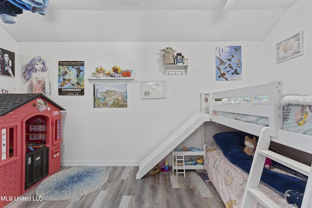11222 Cypress Bayou Dr, Gulfport, MS 39503 - bedroom featuring baseboards, wood finished floors, and lofted ceiling