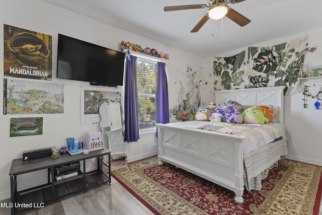 11222 Cypress Bayou Dr, Gulfport, MS 39503 - bedroom with baseboards, wood finished floors, and a ceiling fan