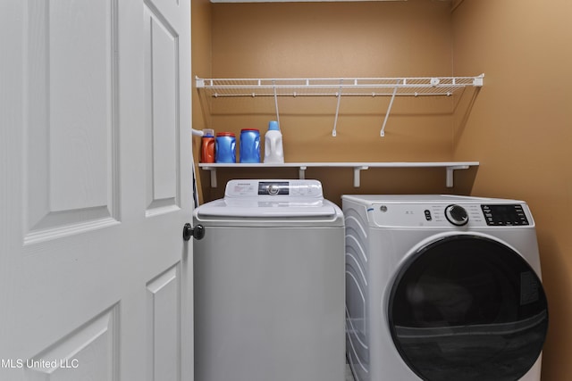 11222 Cypress Bayou Dr, Gulfport, MS 39503 - washroom featuring separate washer and dryer and laundry area
