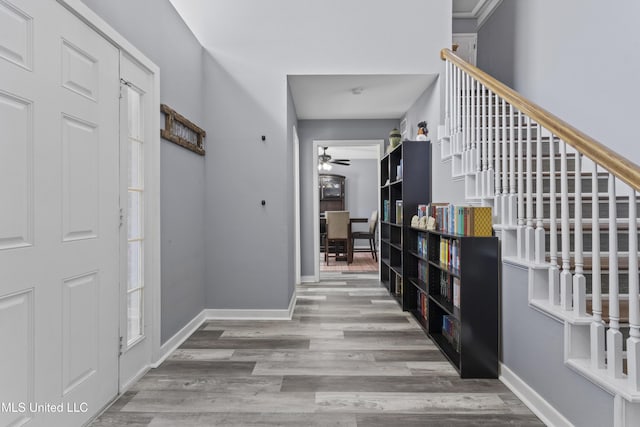 11222 Cypress Bayou Dr, Gulfport, MS 39503 - entryway with baseboards, wood finished floors, and ceiling fan