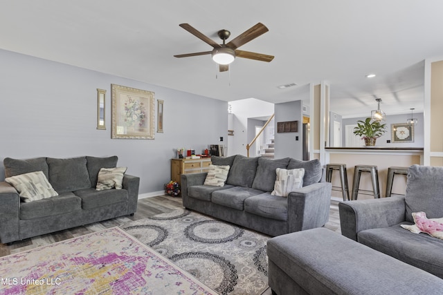 11222 Cypress Bayou Dr, Gulfport, MS 39503 - living area featuring stairway, ceiling fan, visible vents, baseboards, and wood finished floors