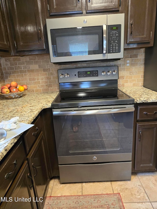 447 Shaker Dr, Senatobia, MS 38668 - kitchen featuring tasteful backsplash, stainless steel appliances, and dark brown cabinets