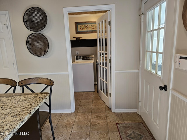 447 Shaker Dr, Senatobia, MS 38668 - washroom featuring laundry area, plenty of natural light, washer / clothes dryer, and wainscoting