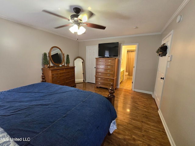 447 Shaker Dr, Senatobia, MS 38668 - bedroom featuring ceiling fan, dark wood finished floors, baseboards, ornamental molding, and ensuite bath