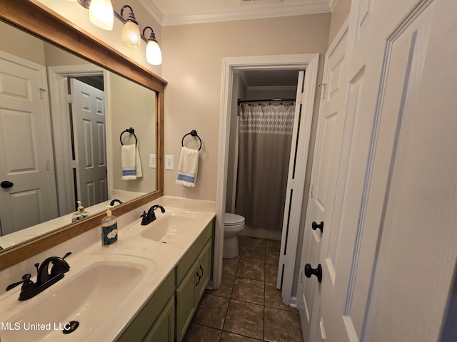 447 Shaker Dr, Senatobia, MS 38668 - full bath with toilet, double vanity, ornamental molding, and a sink