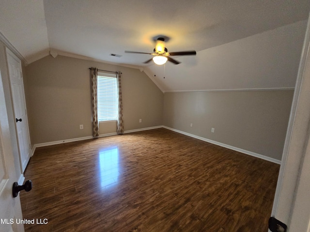 447 Shaker Dr, Senatobia, MS 38668 - additional living space with dark wood-type flooring, lofted ceiling, and baseboards