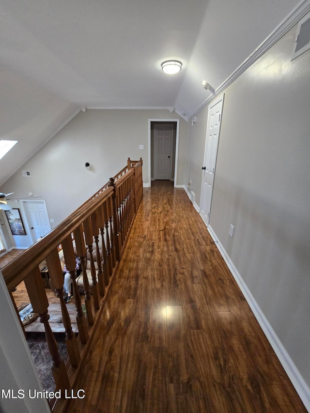 447 Shaker Dr, Senatobia, MS 38668 - hall with baseboards, vaulted ceiling with skylight, visible vents, and wood finished floors